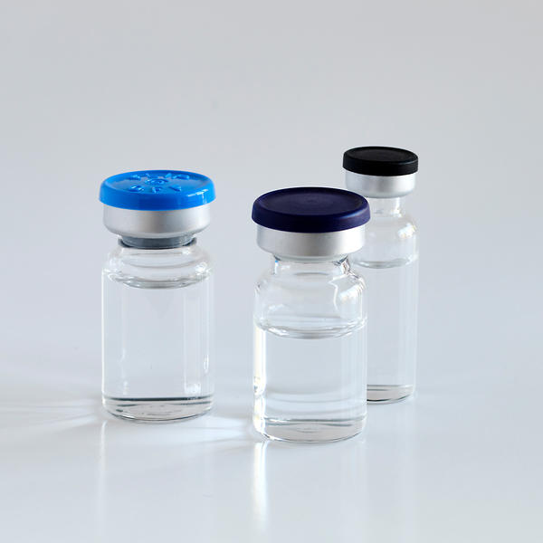 Three liquid vials of varying sizes