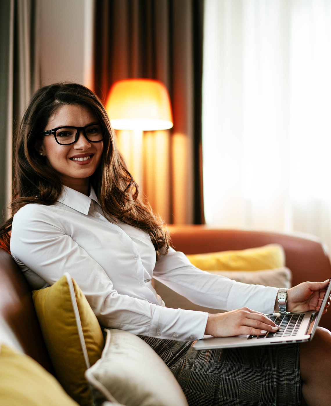 Businesswoman working from a hotel room
